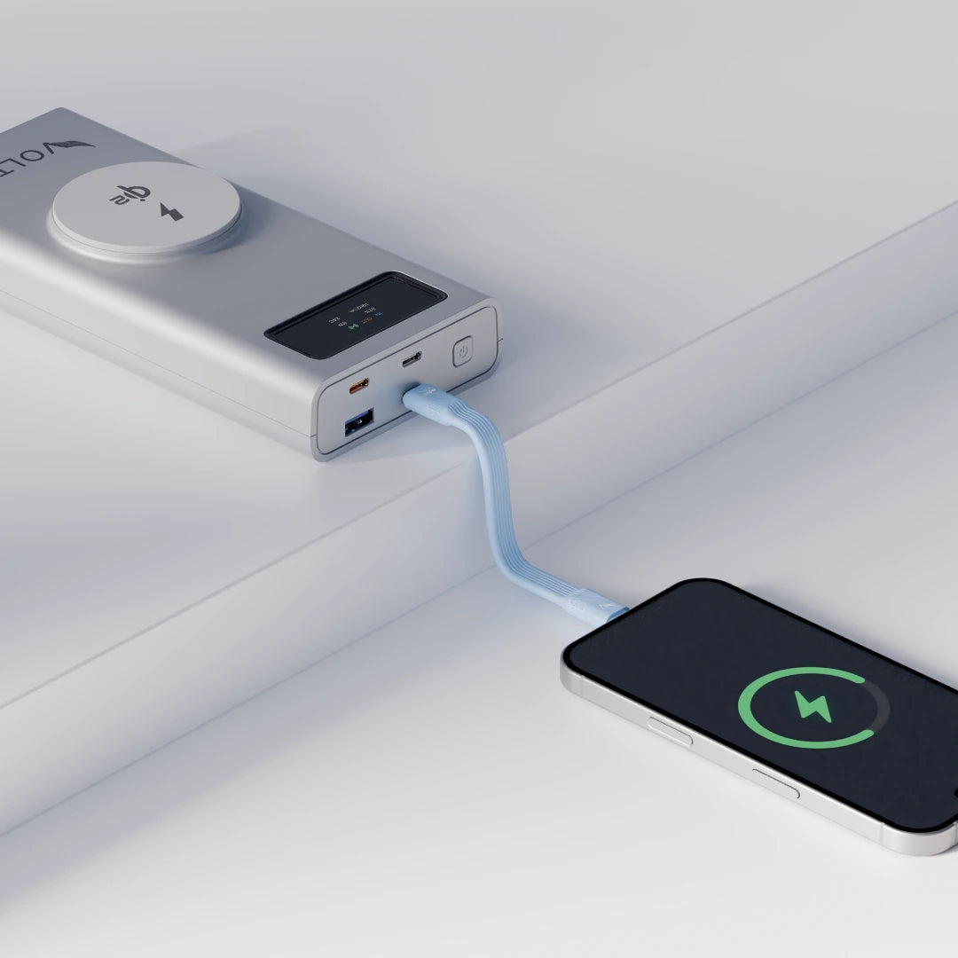 Power bank charging a smartphone on a white background using the volta zero
